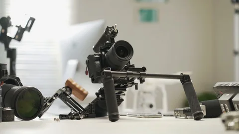 An Asian man is installing a camera rig and fastening it Video stock 128406956