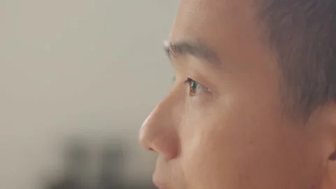 Asian Man Intense Gaze Looking Away Side Profile Close-up 库存影片 335497728