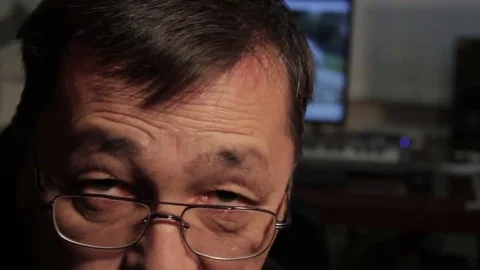 Asian man looking at the camera and corrects hairstyle Stock Footage 69211395