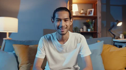 Asian man looking at camera smile and talk with friends on video call online. 스톡 동영상 152994589