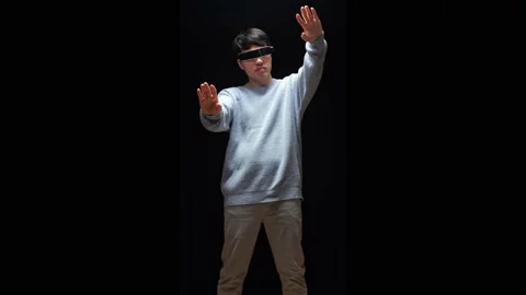 Asian Man Making Gestures With Hands In Air, Play 3D Video Game In Futuristic Stock Footage 223582121