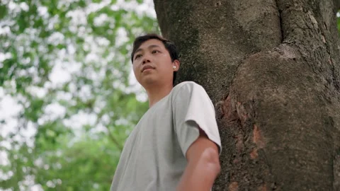 Asian man man thinking about life, looking forward with hope and listening  Stock Footage 283187195