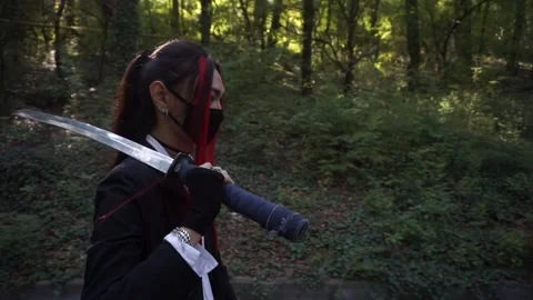 Asian man in mask with sword Stock Footage 143982532