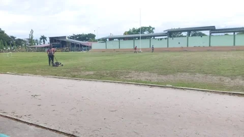 An asian man mowing the grass Video stock 206668518