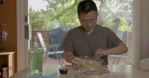 A asian man open his take out food and ready to eat Stock Footage 131927397