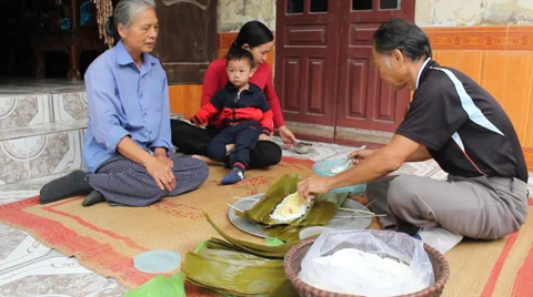 Asian man packing rice cake | Stock Video | Pond5