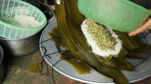 Asian man packing rice cake | Stock Video | Pond5