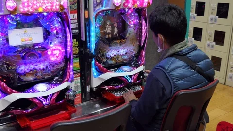 Asian Man Playing Pachinko Lottery Game In Tokyo Japan Asia Stock Footage