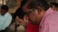 Asian man praying with an European man in Sri Lanka HD Footage