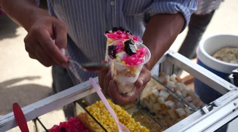 An Asian Man Preparing Famous Baba Ice Cream Under Hot Sunny Day In Malaysia Stock Footage 34632092