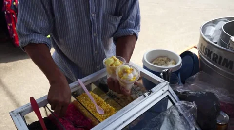 An Asian Man Preparing Famous Baba Ice Cream Under Hot Sunny Day In Malaysia Stock Footage 34730688