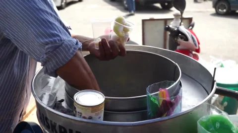 An Asian Man Preparing Famous Baba Ice Cream Under Hot Sunny Day In Malaysia Stock Footage 34730715