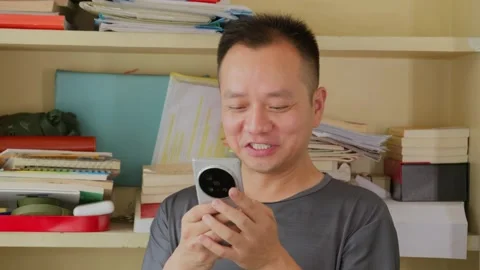 Asian man reading meme and entertainment on social media Stock Footage 342470921