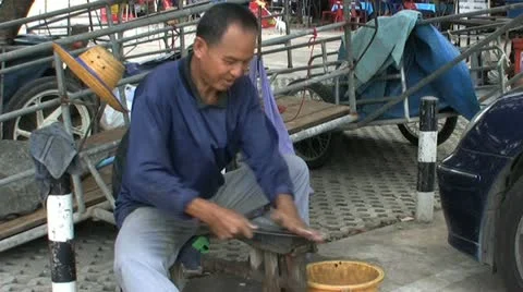 Asian Man Sharpening A Knife 스톡 동영상 12325206