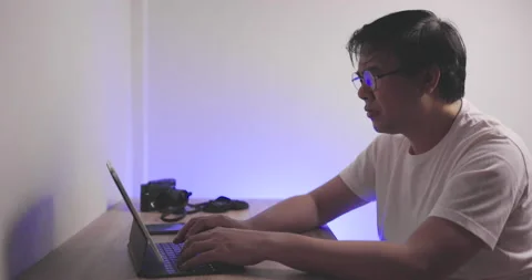 Asian man sit in room work hard with stress and his heart muscle ache. Stock Footage 158489017