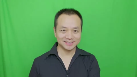 Asian man smiled at the camera friendly, nodded friendly Stock Footage 321231815