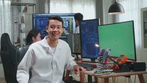 Asian Man Smiling Charmingly Looking At Camera. Young Intelligent Male Scientist Stock Footage 160562823