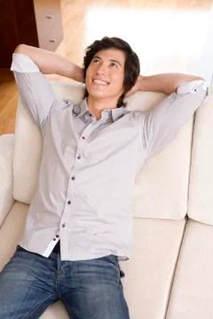 Asian man on sofa Stock Photos
