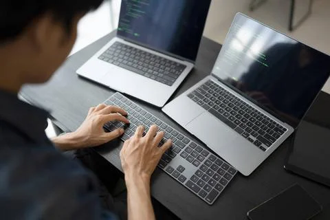 Asian man software engineer Working on Computer at office desk for writing... Stock-Fotos