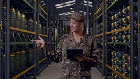 Asian Man Soldier Using A Tablet And Pointing To Side In Military Storage Stock Footage 313736981