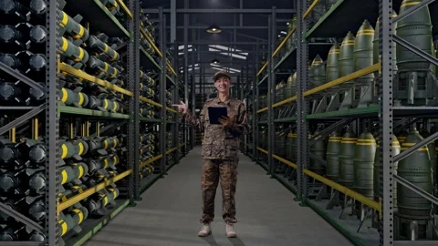Asian Man Soldier Using A Tablet And Pointing To Side In Military Storage Stock Footage 313738799