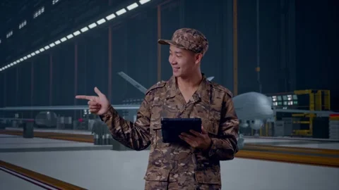 Asian Man Soldier Using A Tablet And Pointing To Side , Military Drone Stock Footage 314937719