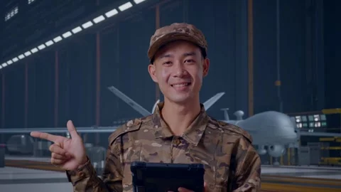 Asian Man Soldier Using A Tablet And Pointing To Side , Military Drone Stock Footage 314938028