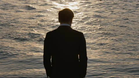 Asian man stood by River Stock Footage 130343985