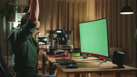 Asian Man Stretching While Work On 3D Printer And Personal Computer With Mock Up Stock Footage 158104919