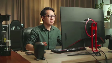 Asian Man Stretching While Works On Personal Computer And 3D Printer In Home Stock Footage 158108052