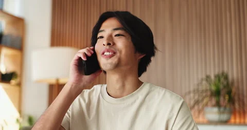 Asian man, student and good news with phone call in house for education results Stock Footage 327373732