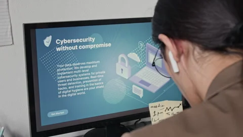 Asian Man Studying Cybersecurity Information on Computer Screen Video stock 336711026