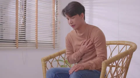Asian man suffered a heart attack, resulting in chest pain and illness on the Stock Footage 167719059