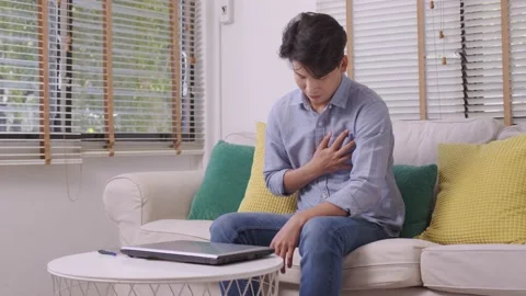 Asian man suffered a heart attack, resulting in chest pain and illness on the Stock Footage 167719926
