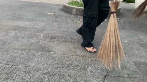 Asian man sweeper in action Stock Footage 230627869