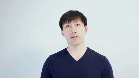 Asian man talking to the camera for a longer time Stock Footage 248869102