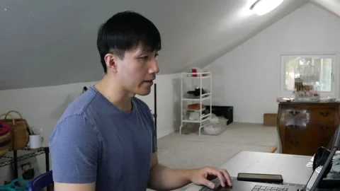 Asian man talking on his webcam to his classmates Stock-Footage 247874330