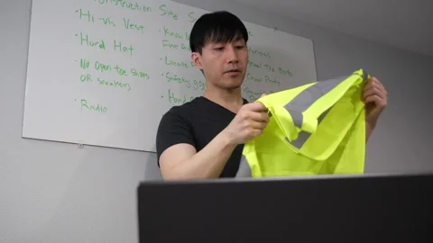 Asian man teaching an online class on construction work safety Stock Footage 263858571