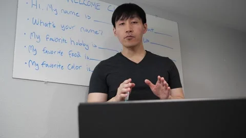 Asian man teaching an online class about english and vocabulary Stock Footage 263858838