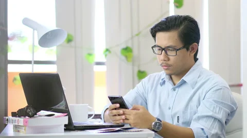 Asian Man Texting at Office - 4K Resolution Stock Footage 60608357