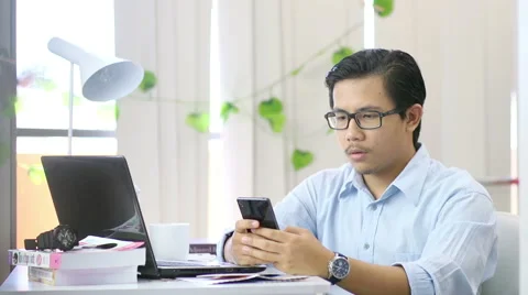 Asian Man Texting at Office - Slow Motion Stock Footage 60608402
