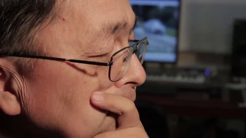Asian man thinking matters and getting down to work Stock Footage 69211309