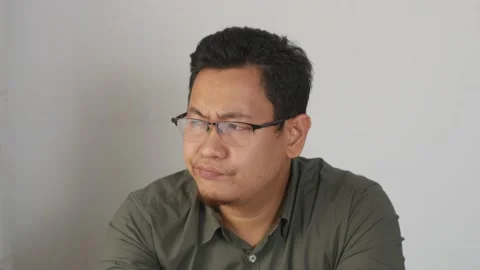 Asian man thinking something. Looking for solution of a problem, pensive conf Video stock 141612754
