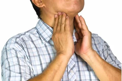 Asian man with thyroid problems. He touched his neck closely. Medical concept Stock Photos