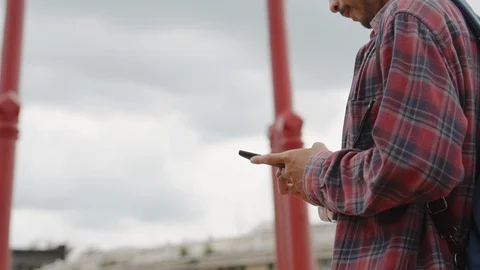 Asian  man tourist using  smart phone at Tourist attraction  in Bangkok city. Stock Footage 118836491