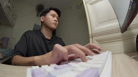Asian Man Typing On Computer Keyboard At Home Office, Fisheye Lens POV View Stock Footage 334531538
