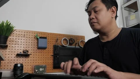 Asian man typing on pc computer at home, freelancer working remotely, onlin.. Stock Footage 295982891