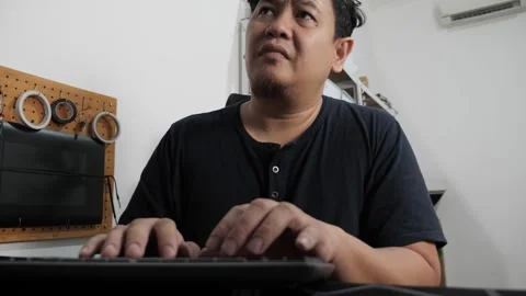 Asian man typing on pc computer at home, freelancer working remotely, onlin.. Stock Footage 295982914