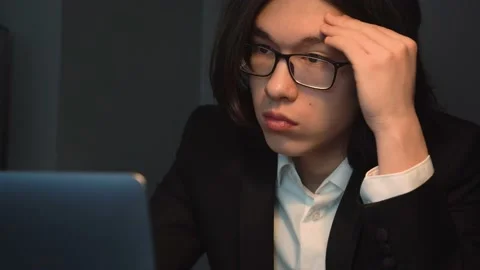 Asian Man Typing Working at the Office Concentratedly Thinking / Close-up Stock Footage 148343420