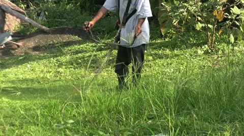 Asian Man Using A Disc Weed Cutter 스톡 동영상 12588222